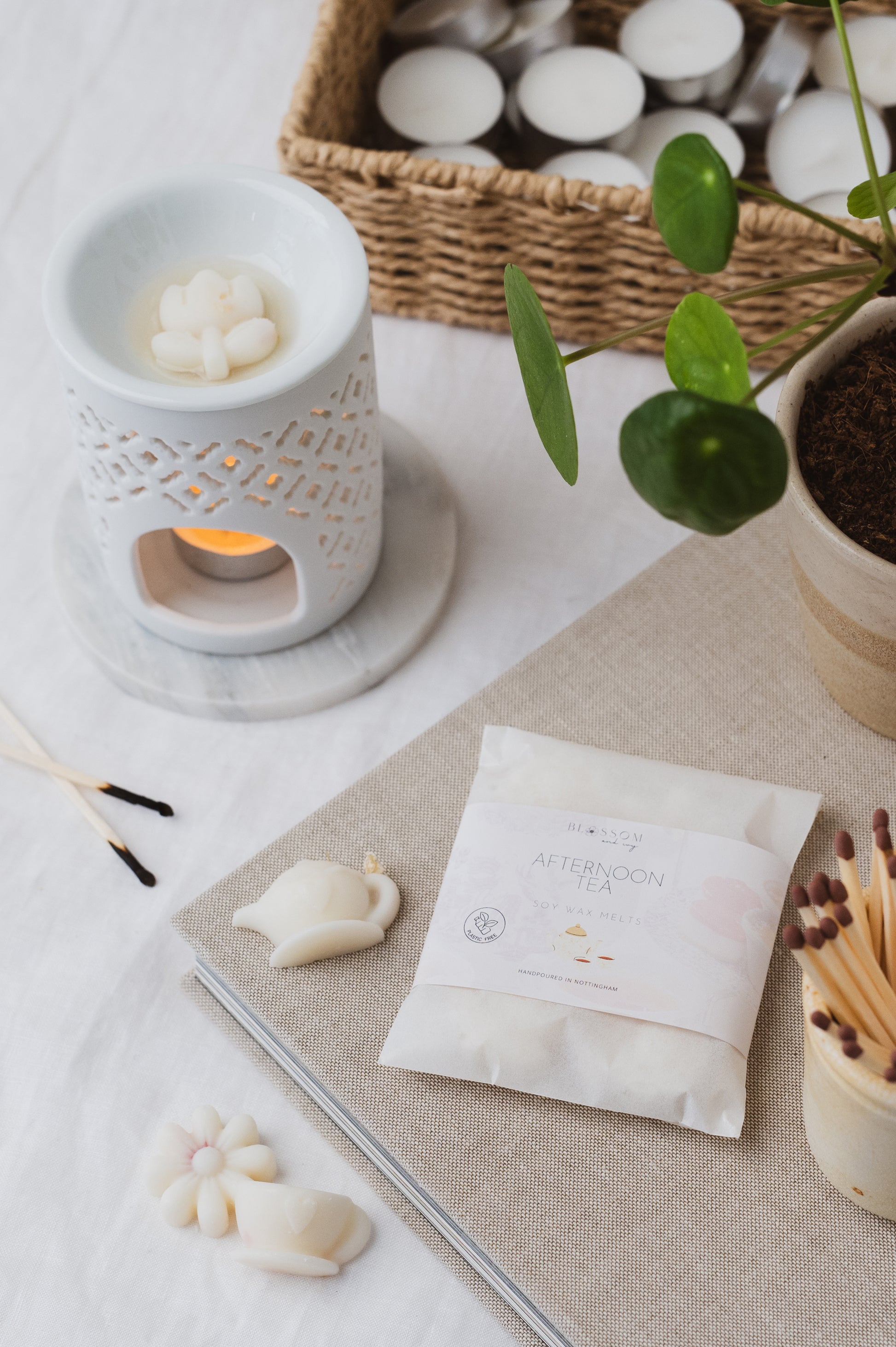 The picture depicts our Afternoon Tea Wax Melts Melting in a Wax Burner